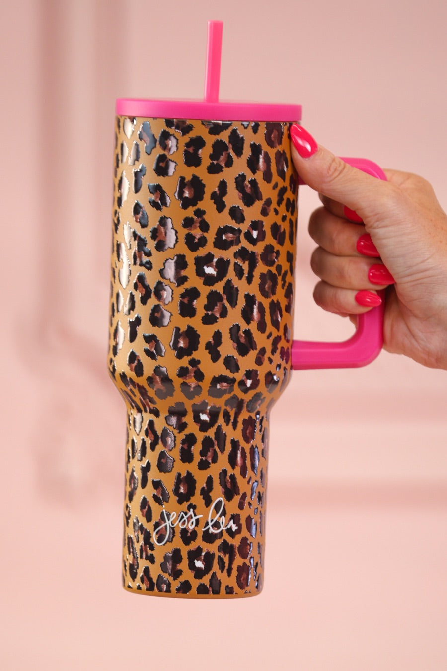 40-ounce tumbler with a hot pink and leopard print design, handle, screw-on lid, and a reusable straw
