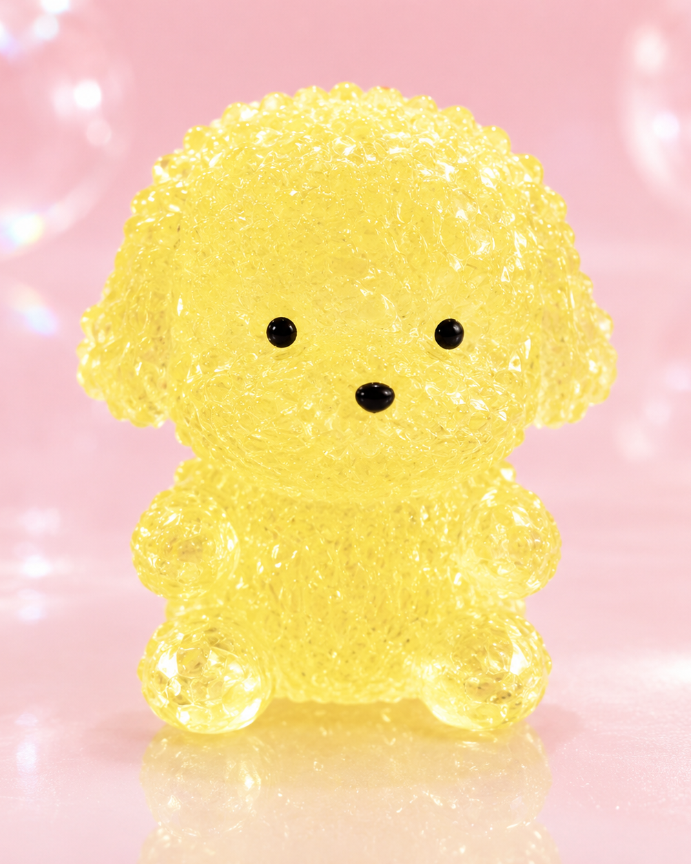 a yellow gel-filled puppy-shaped squishy with a translucent crystal-like texture, assorted colors, tiny face details, and a soft handheld design