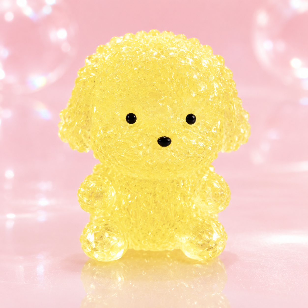 a yellow gel-filled puppy-shaped squishy with a translucent crystal-like texture, assorted colors, tiny face details, and a soft handheld design