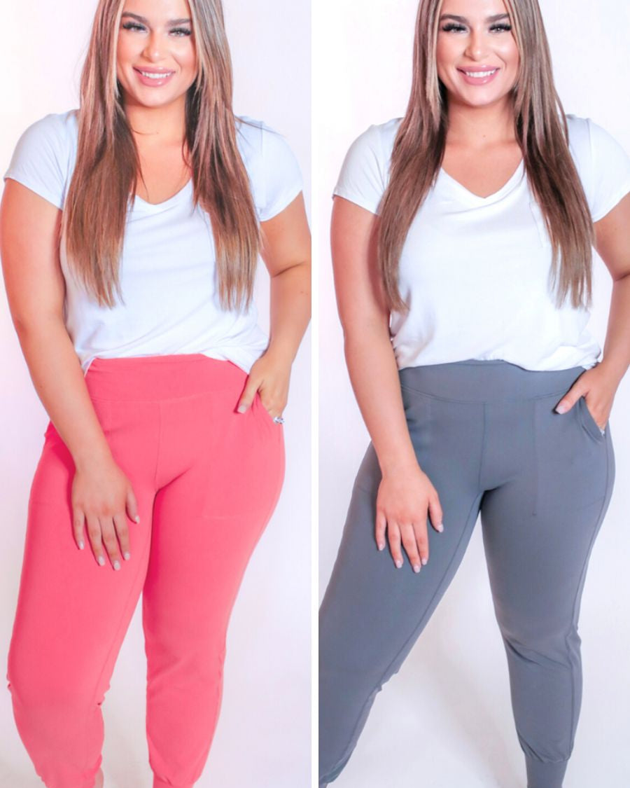 high-rise joggers crafted on smooth stretch fabric with a 3" waistband, side pockets, interior waistband back pocket, contoured back seam detail, tapered leg, and cuffed ankles in coral and gray
