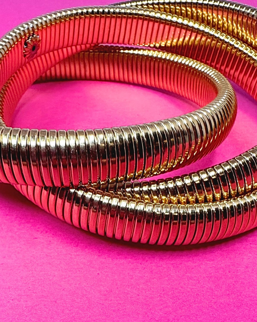 three intertwined stretch bands with a slip-on design in gold