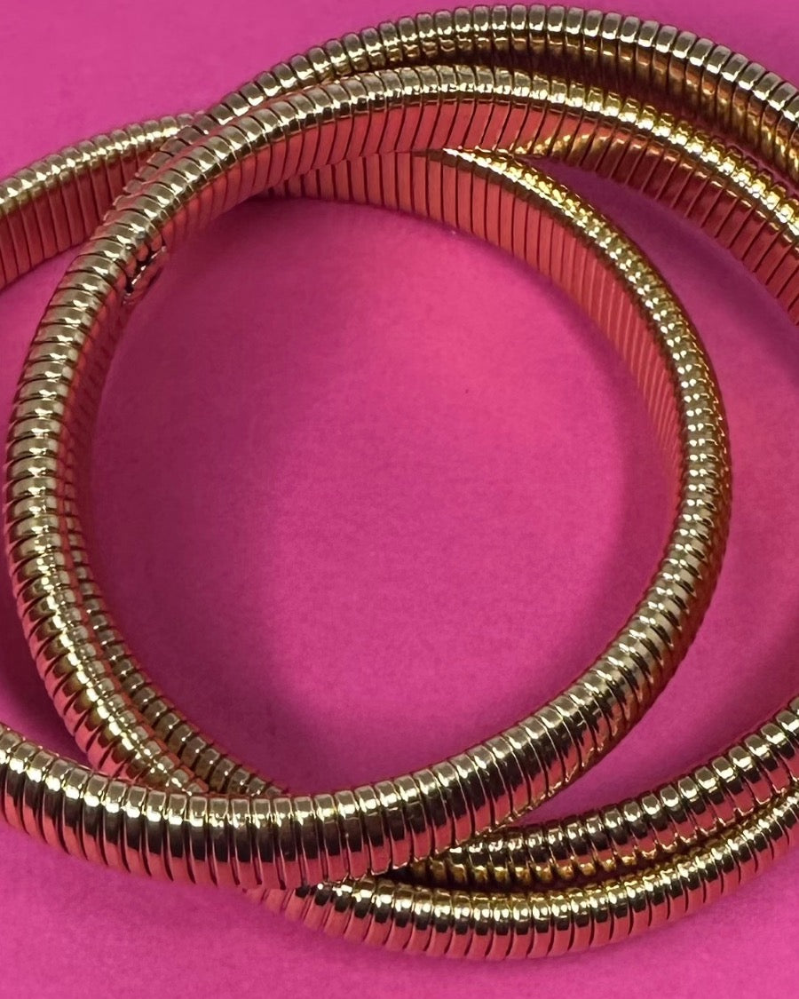 three intertwined stretch bands with a slip-on design in gold