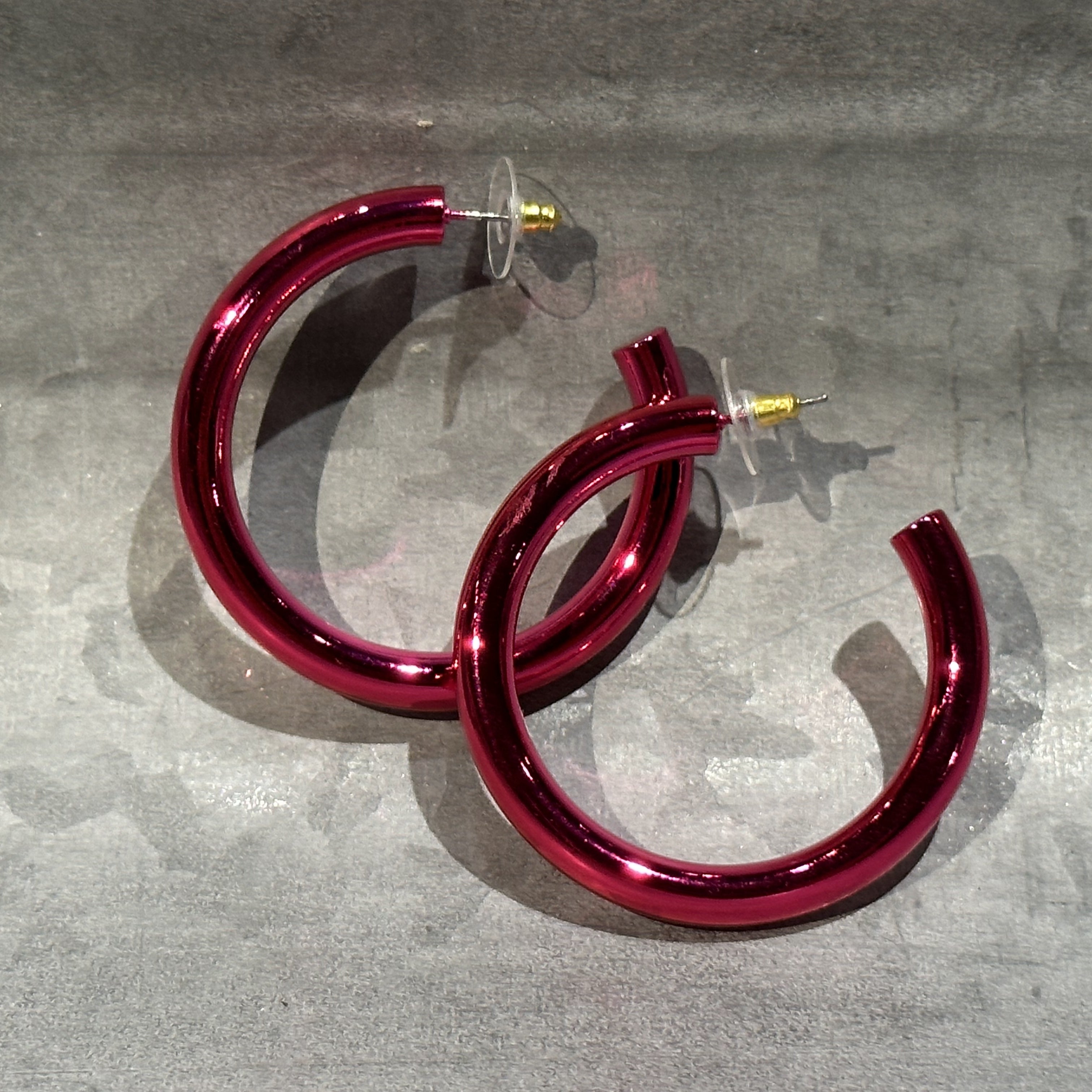 classic hoop style stud earrings in pink