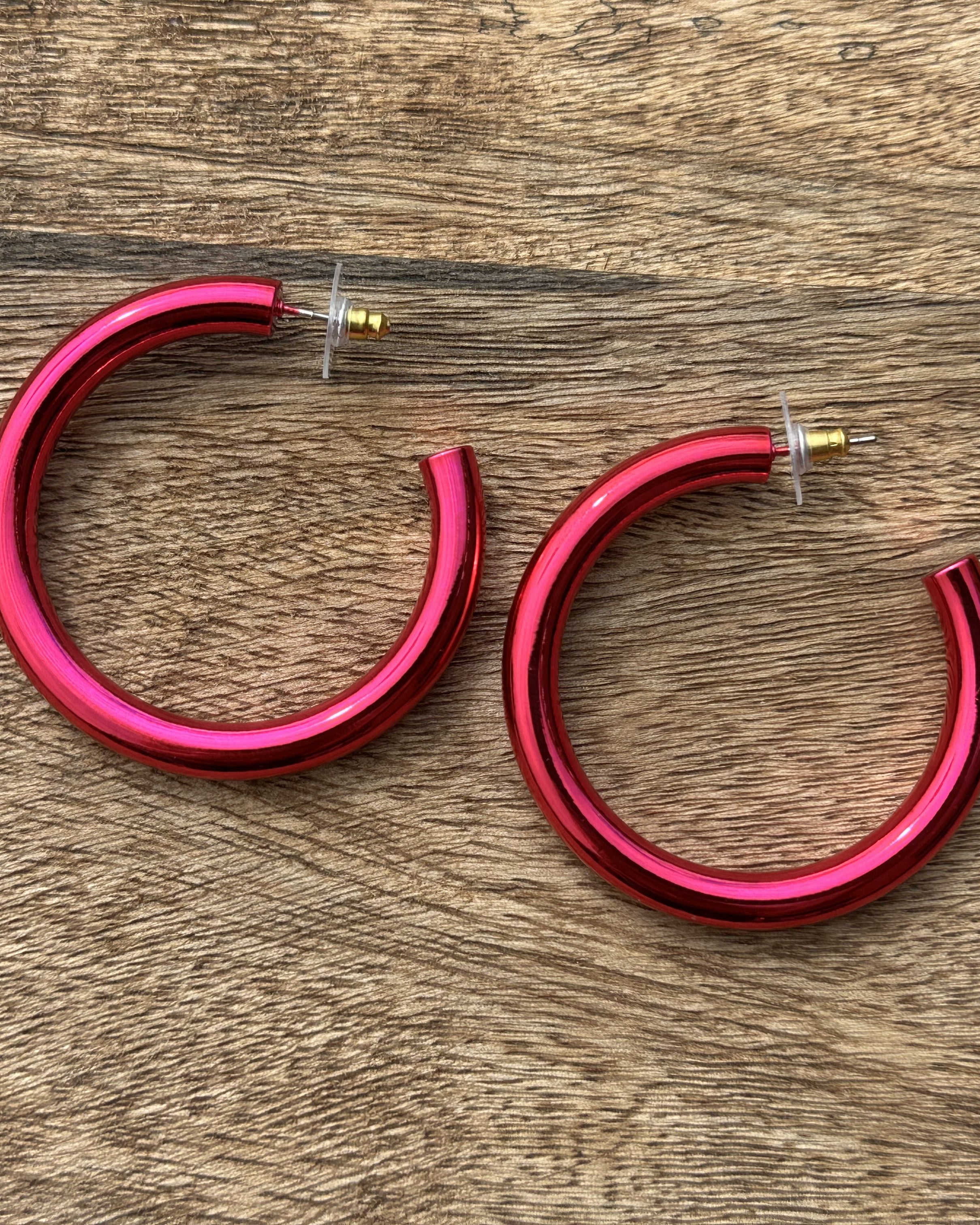 classic hoop style stud earrings in pink