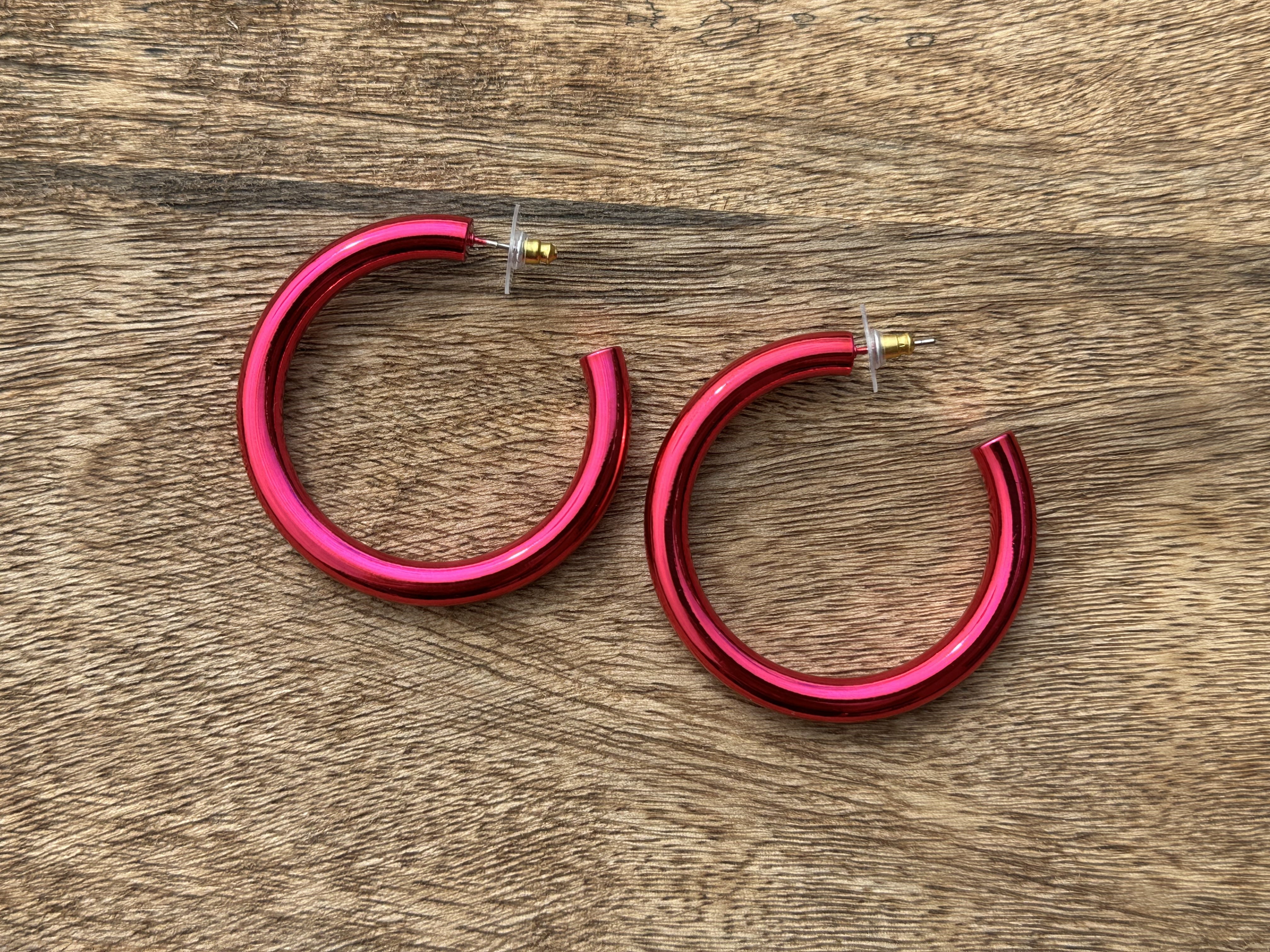 classic hoop style stud earrings in pink
