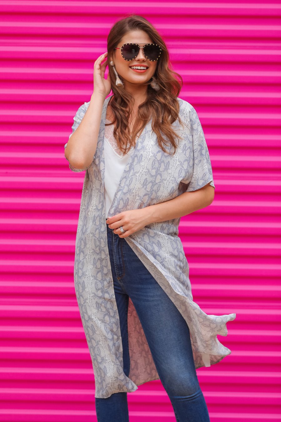 an open front kimono made of lightweight material with loose short sleeves on a subtle snake print pattern