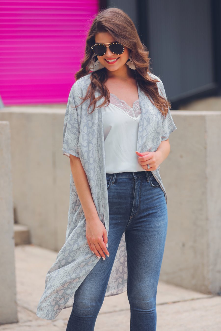 an open front kimono made of lightweight material with loose short sleeves on a subtle snake print pattern