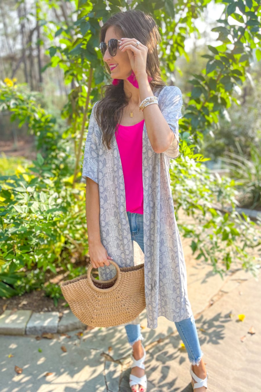 an open front kimono made of lightweight material with loose short sleeves on a subtle snake print pattern