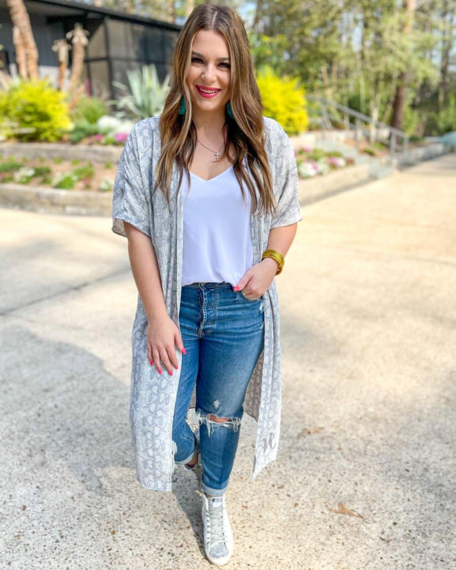 an open front kimono made of lightweight material with loose short sleeves on a subtle snake print pattern