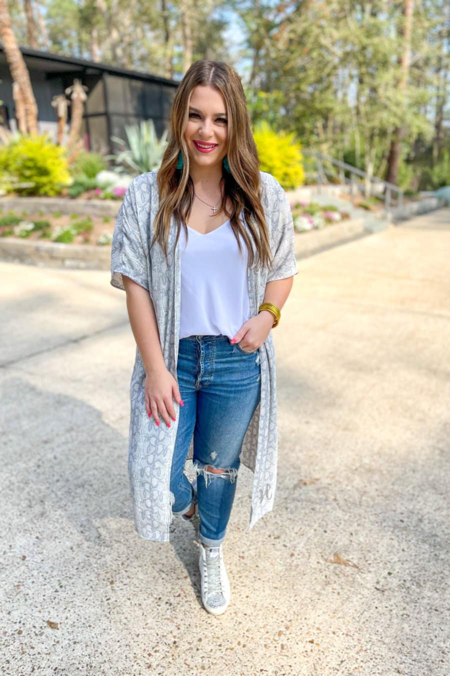 an open front kimono made of lightweight material with loose short sleeves on a subtle snake print pattern