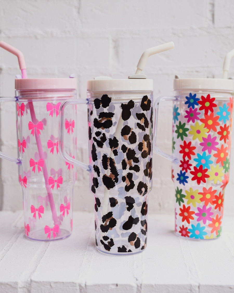 40-ounce pink bows, animal. print, and flowers pattern acrylic tumblers with a reusable clear straw, flexible mouthpiece, handle, screw-on lid, and car cup holder compatible