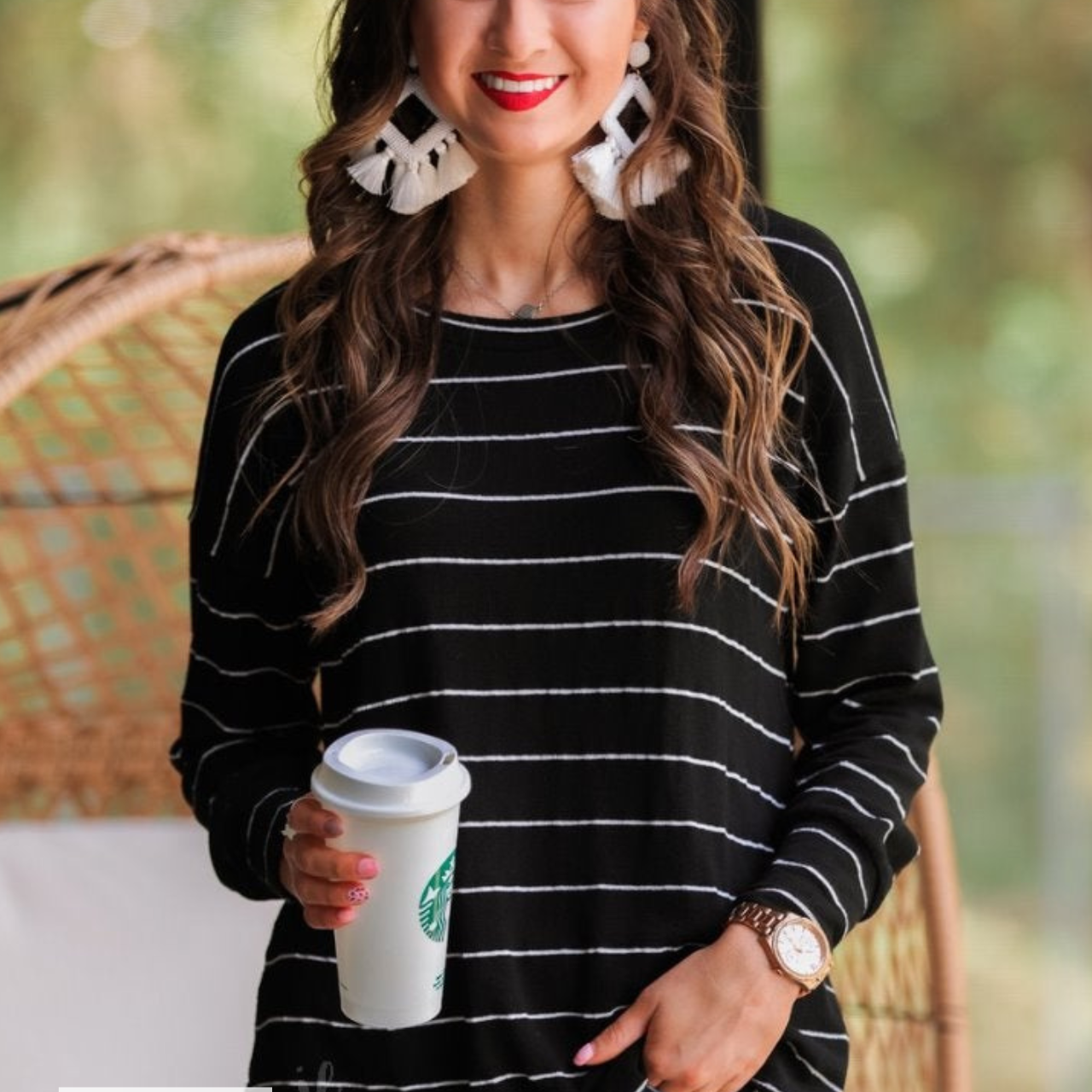 MADE IN USA lightweight horizontal striped top with long sleeves, a crew neckline, and a slouched silhouette that ends in a rounded hemline on a solid black base