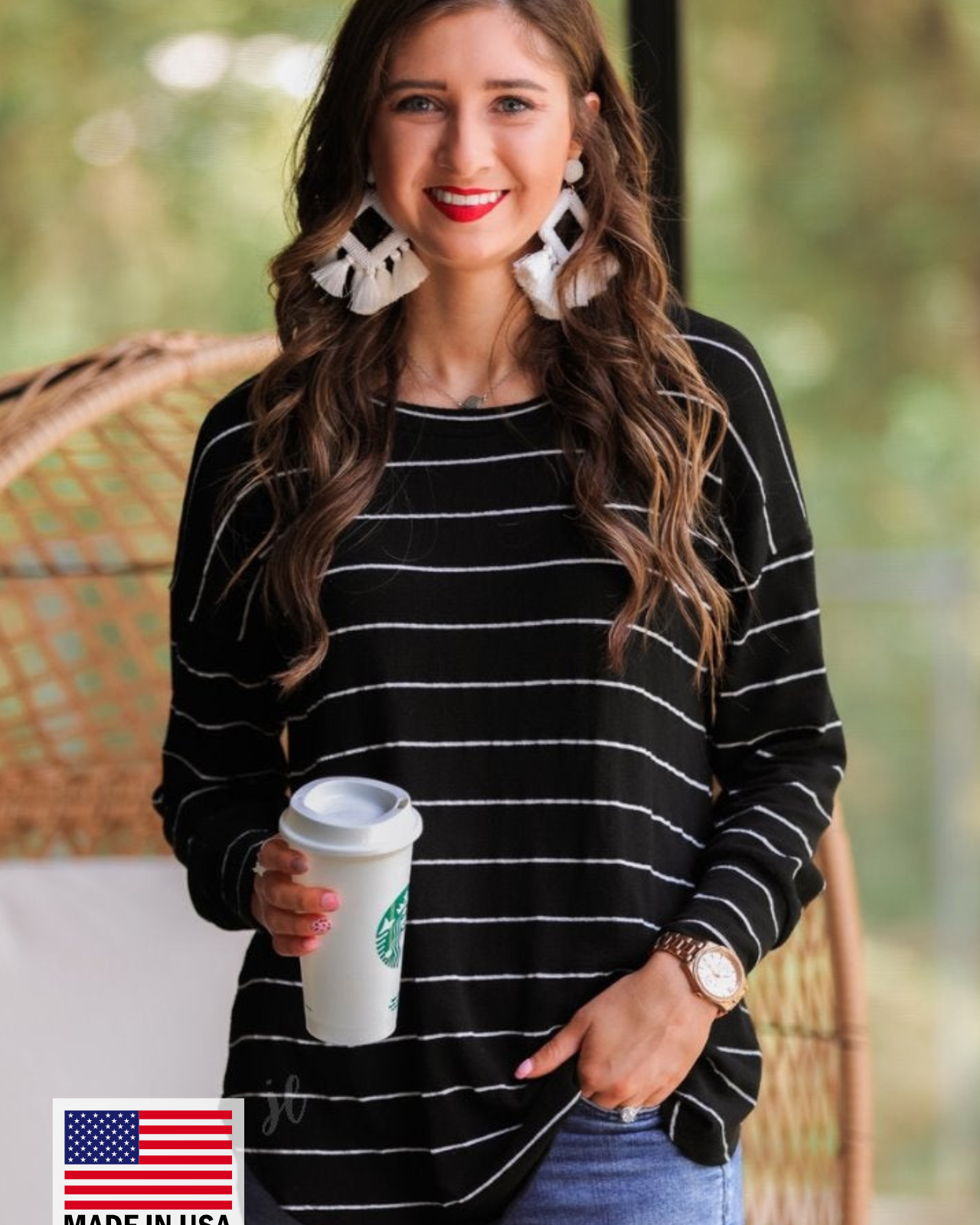 MADE IN USA lightweight horizontal striped top with long sleeves, a crew neckline, and a slouched silhouette that ends in a rounded hemline on a solid black base