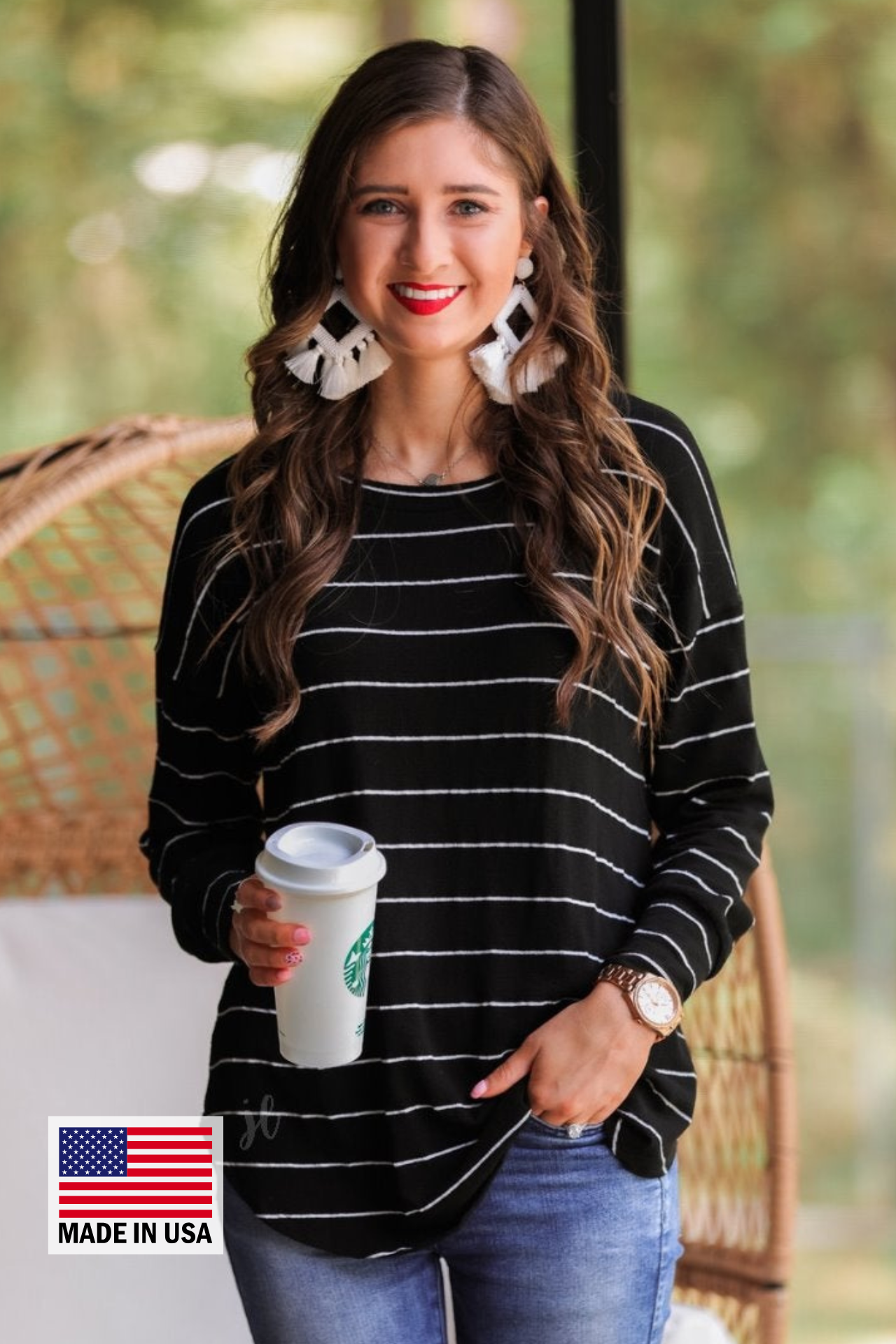 MADE IN USA lightweight horizontal striped top with long sleeves, a crew neckline, and a slouched silhouette that ends in a rounded hemline on a solid black base