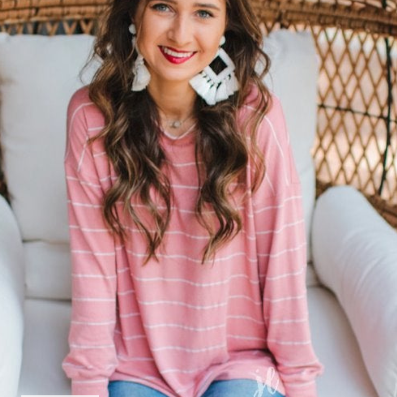 MADE IN USA lightweight horizontal striped top with long sleeves, a crew neckline, and a slouched silhouette that ends in a rounded hemline on a solid mauve base