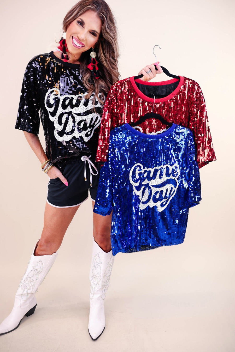 a full sequin design top on a solid color with the words 'Game Day" on the center front outlined in white sequins, a boxy fit, and a lined interior in black, red, and royal blue