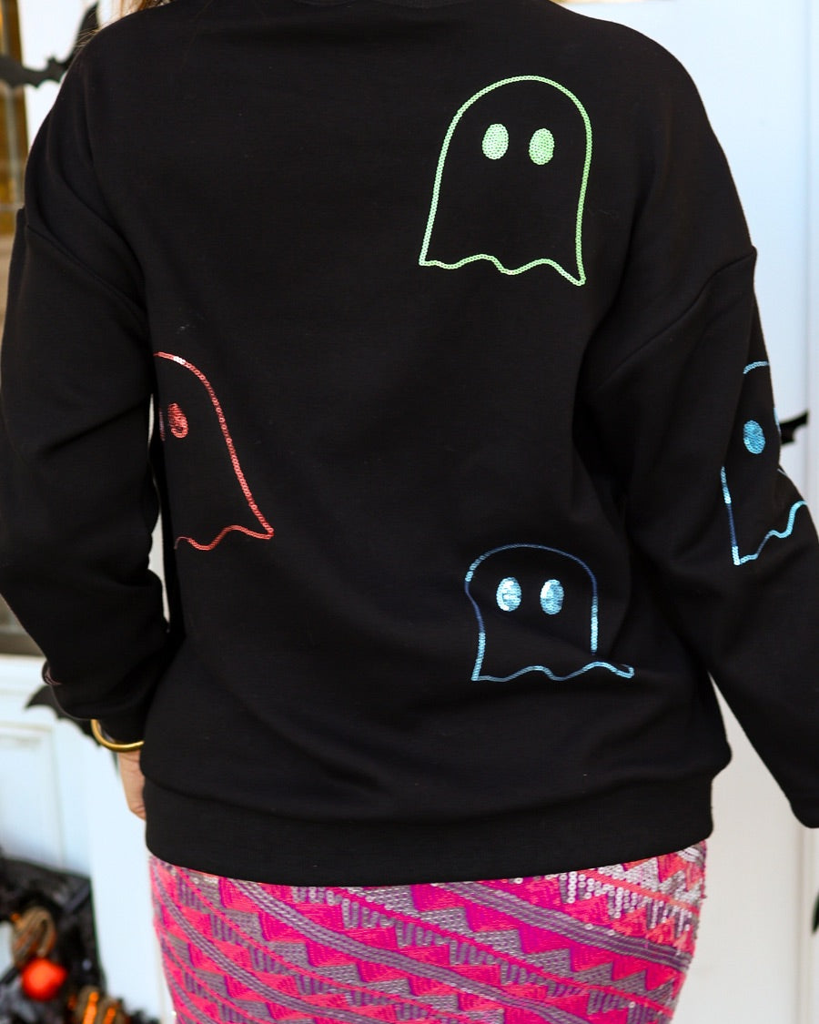 a black long-sleeve pullover crafted from soft fabric with a crew neckline, dropped shoulders, ribbed cuffs, banded hem, relaxed fit, classic sweatshirt silhouette, and colorful sequin ghost outline pattern across the front, back, and sleeve