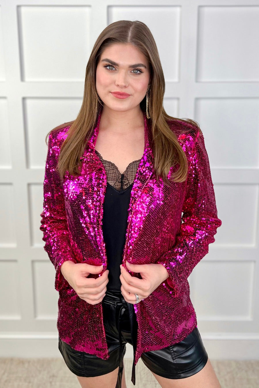 a full sequin-covered long-sleeve blazer with a structured collar, subtle shoulder pads, a smooth interior lining, and a center back vent in pink