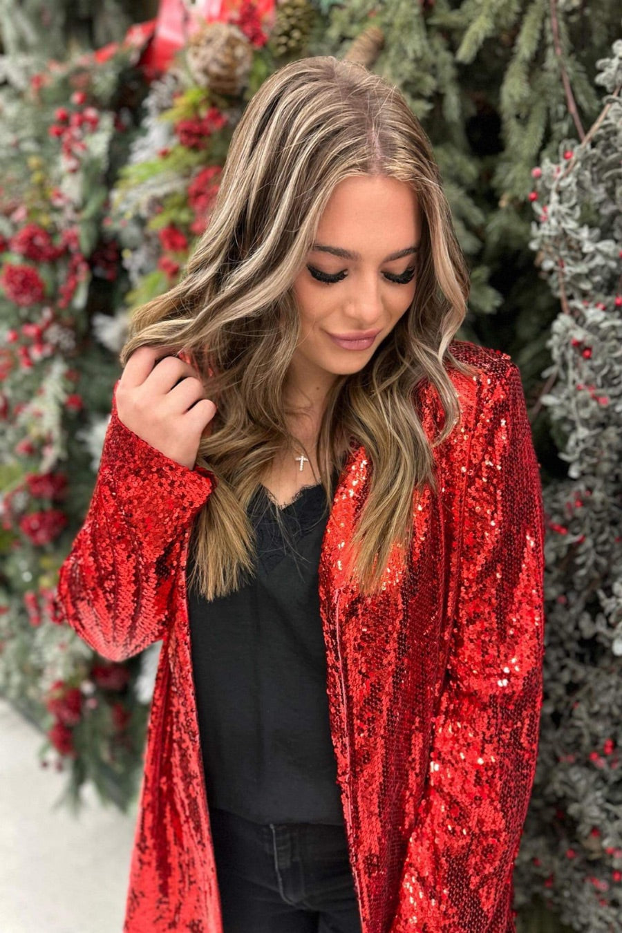 a full sequin-covered long-sleeve blazer with a structured collar, subtle shoulder pads, a smooth interior lining, and a center back vent in red