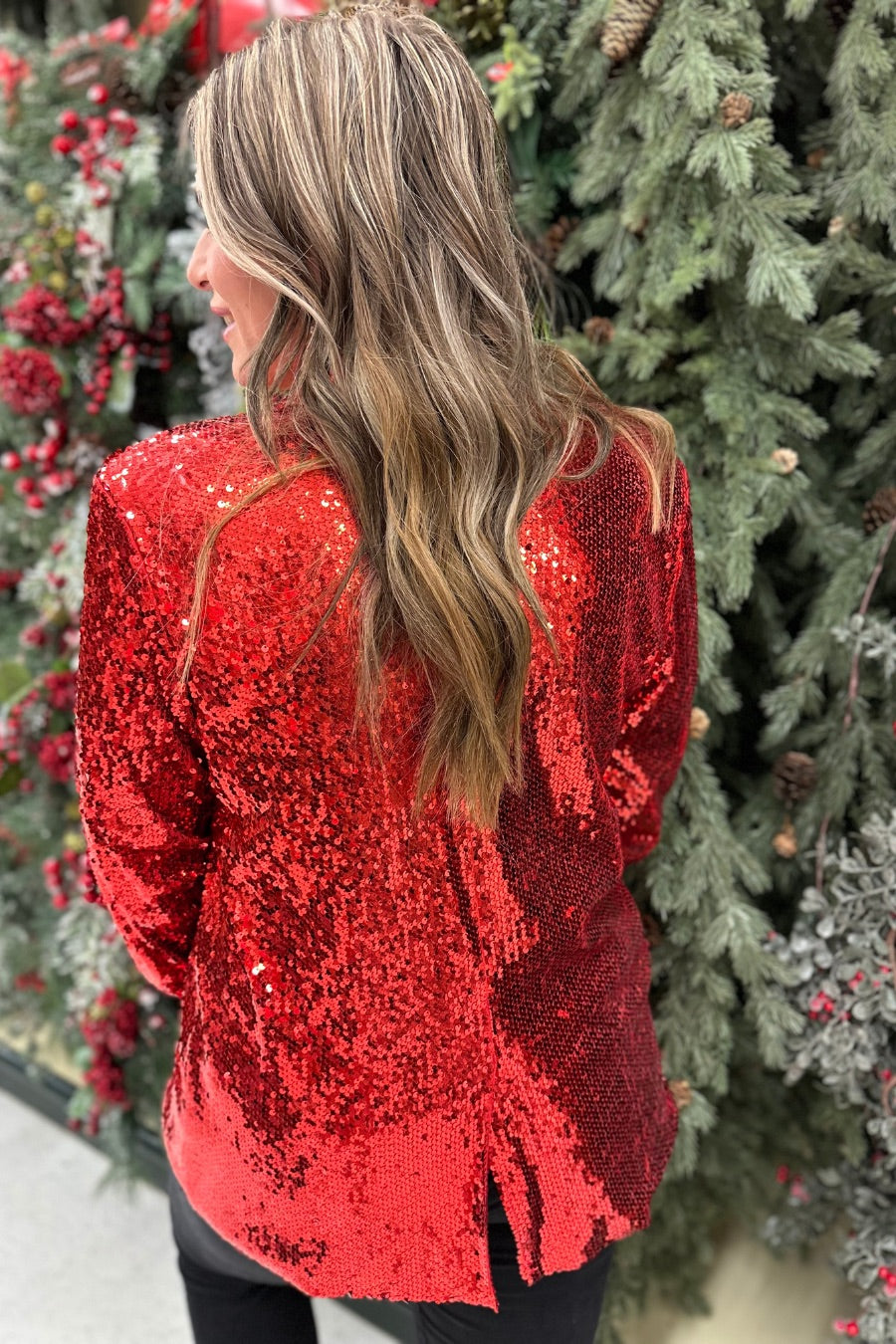 a full sequin-covered long-sleeve blazer with a structured collar, subtle shoulder pads, a smooth interior lining, and a center back vent in red