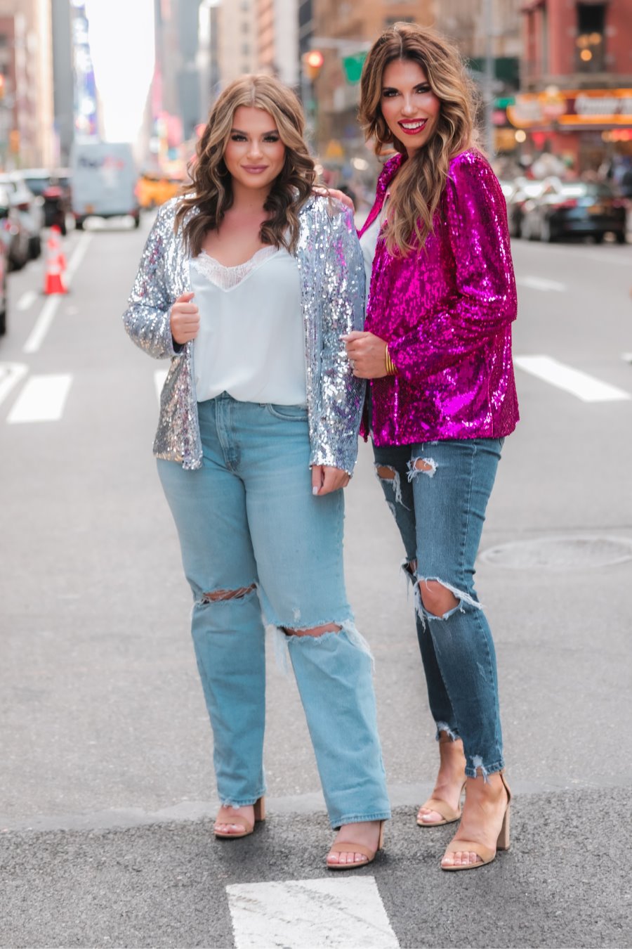a full sequin-covered long-sleeve blazer with a structured collar, subtle shoulder pads, a smooth interior lining, and a center back vent in pink and silver