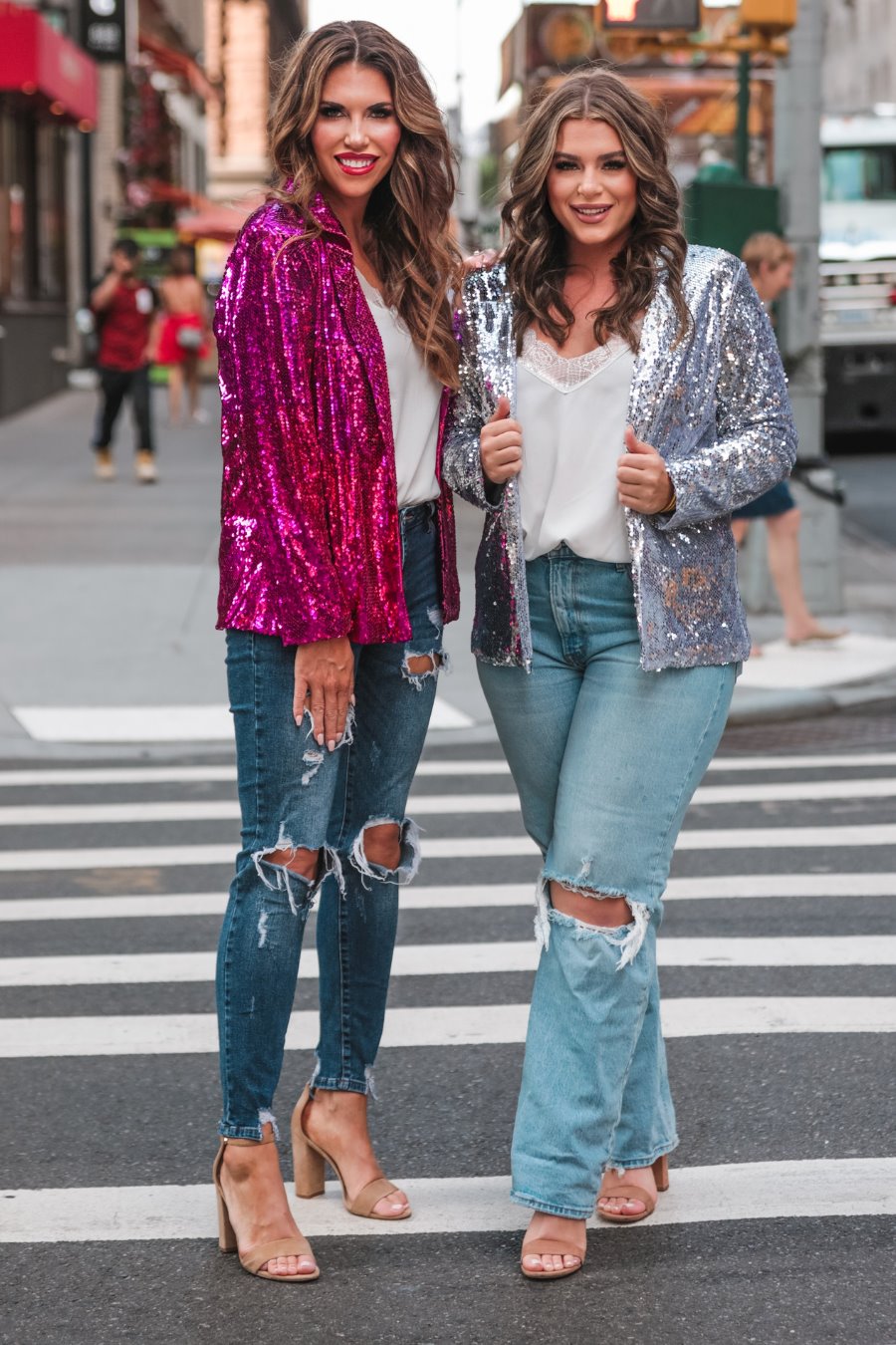 a full sequin-covered long-sleeve blazer with a structured collar, subtle shoulder pads, a smooth interior lining, and a center back vent in pink and silver