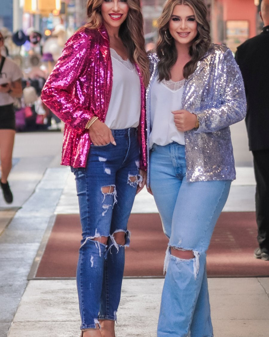 a full sequin-covered long-sleeve blazer with a structured collar, subtle shoulder pads, a smooth interior lining, and a center back vent in pink and silver
