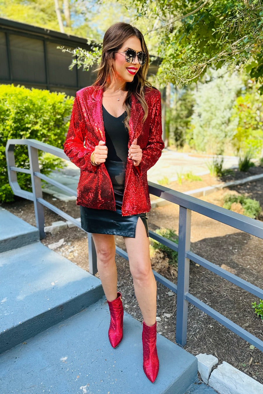 a full sequin-covered long-sleeve blazer with a structured collar, subtle shoulder pads, a smooth interior lining, and a center back vent in red