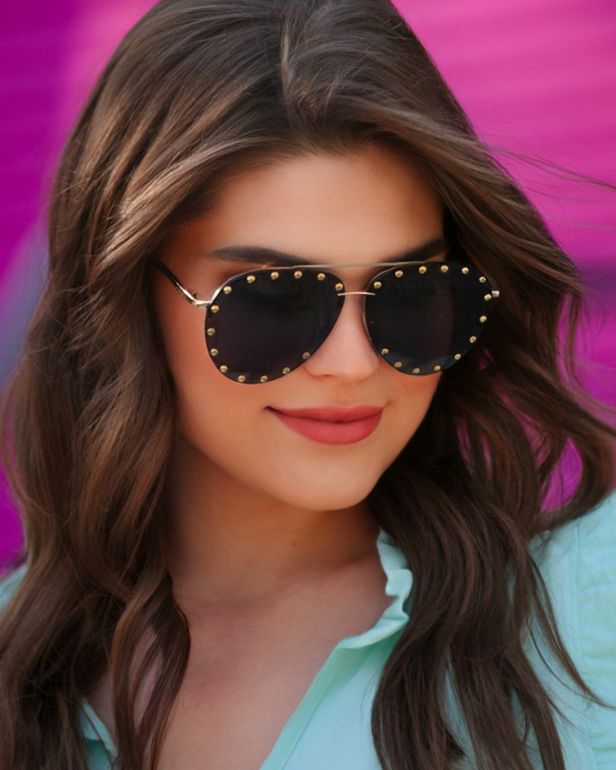 black aviator sunglasses with black tinted lenses, mini gold stud trim along the lens edge, round wireframes with matching brow bar, UV protection, and brand detail (on both the temple and the complimentary black pouch