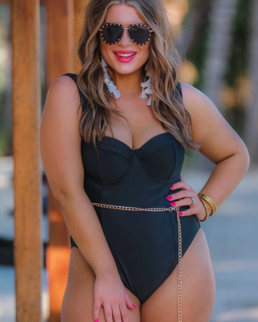 black aviator sunglasses with black tinted lenses, mini gold stud trim along the lens edge, round wireframes with matching brow bar, UV protection, and brand detail (on both the temple and the complimentary black pouch