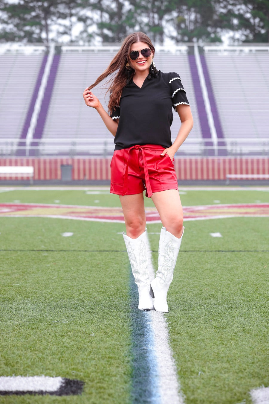 a playful V-neckline top with a ric rac trim detailing on the layered ruffled short sleeves