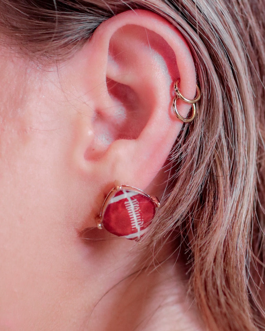 lightweight stud earrings with sporty prints with gold post-style earring backs and clear rubber stopper in brown for football