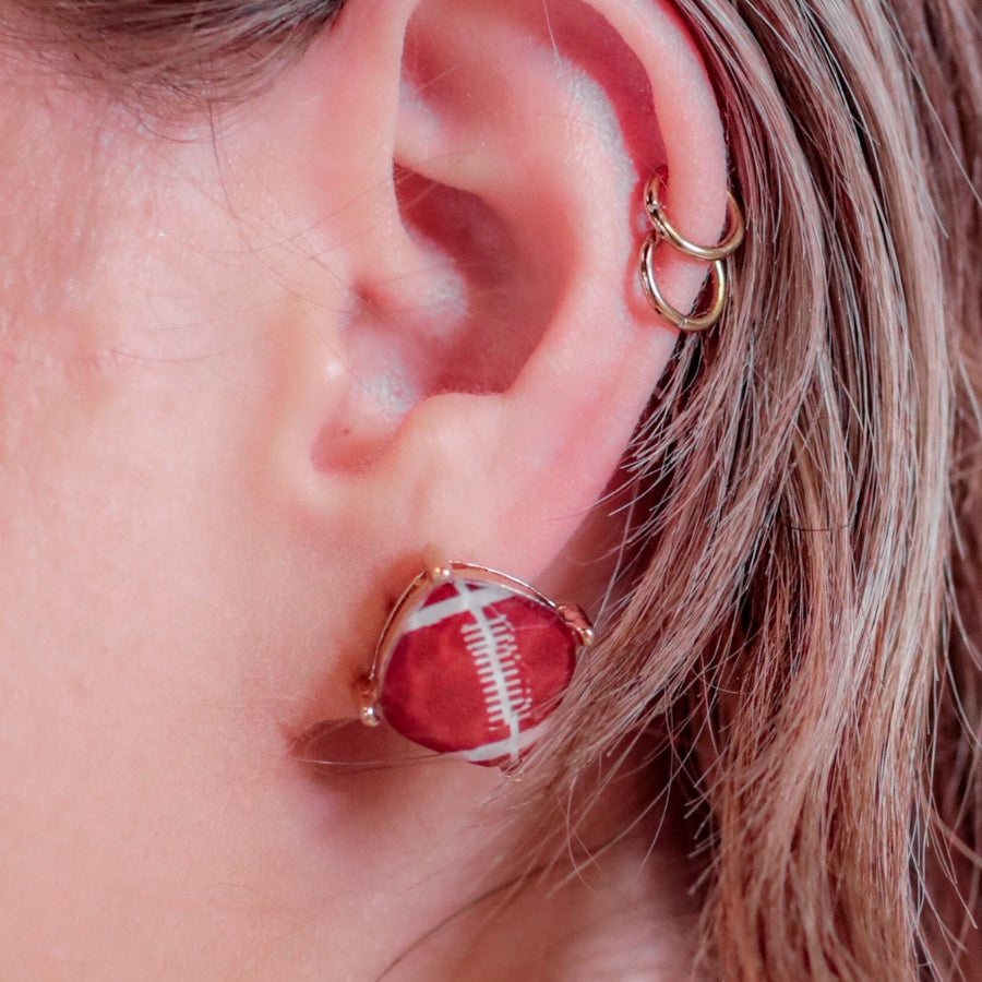 lightweight stud earrings with sporty prints with gold post-style earring backs and clear rubber stopper in brown for football