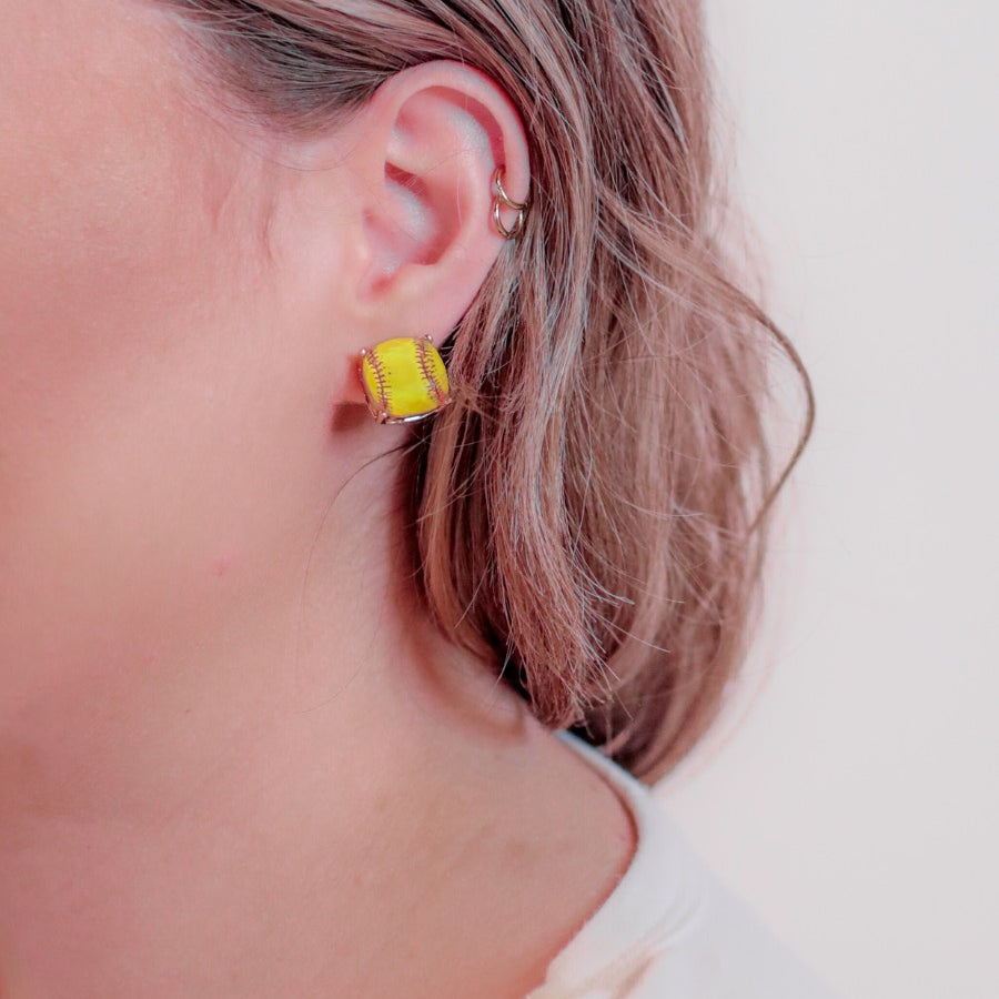 lightweight stud earrings with sporty prints with gold post-style earring backs and clear rubber stopper in yellow for softball