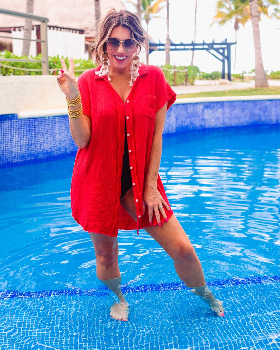 lightweight, non-stretchy gauze button-up coverup with a raw hem, chest pocket, and collar in red