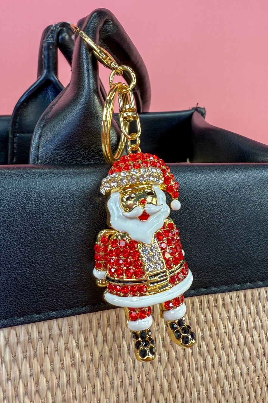 a gleaming Santa bag charm with sparkling rhinestones, movable arms, a solid heavyweight feel, a gold-tone swivel clasp with matching keyring, and a fully gold openwork back for added dimension