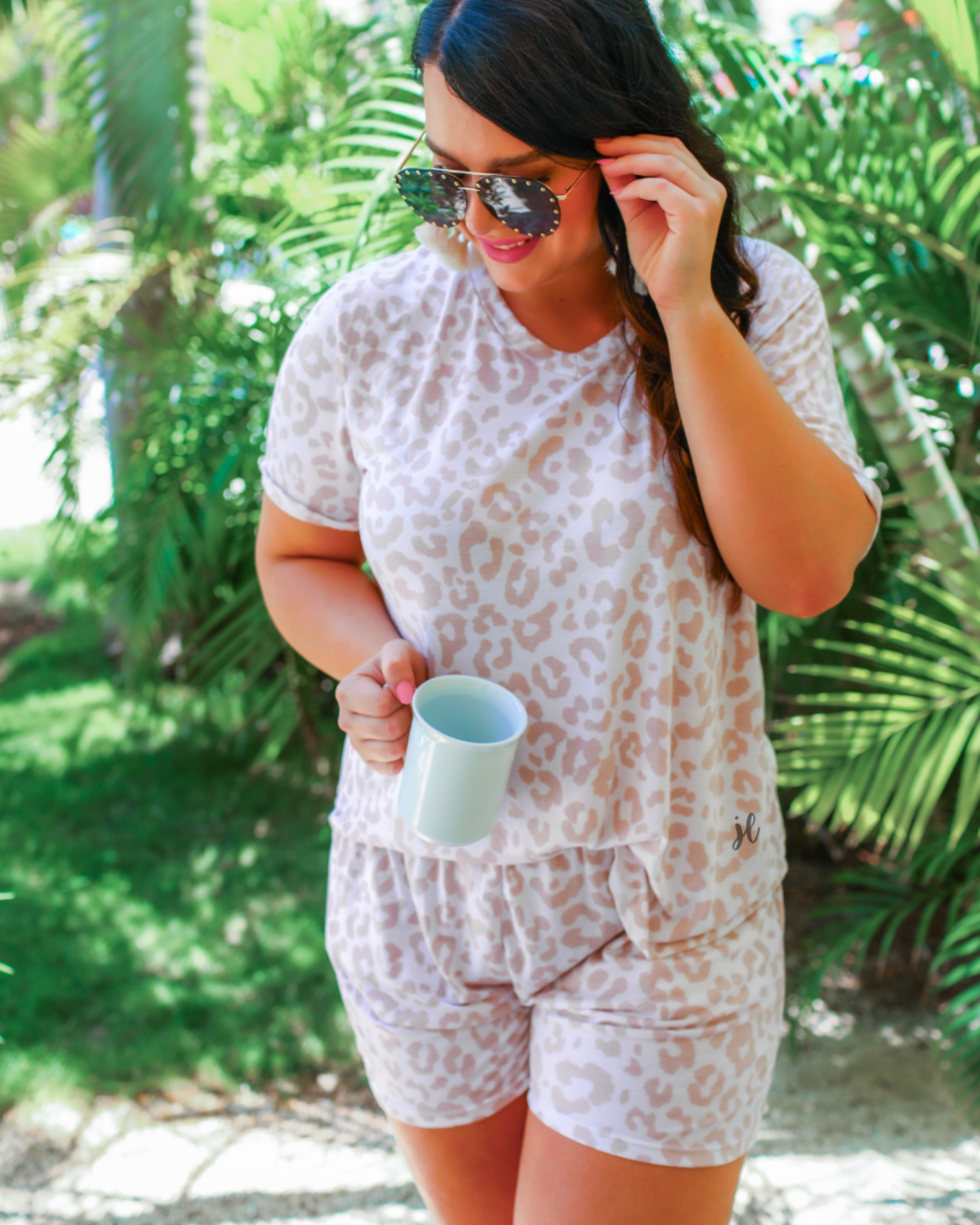 a neutral taupe animal print lounge set crafted from soft stretch fabric with a short-sleeve V-neck top, matching pull-on shorts, elastic waistband, side pockets, and relaxed fit