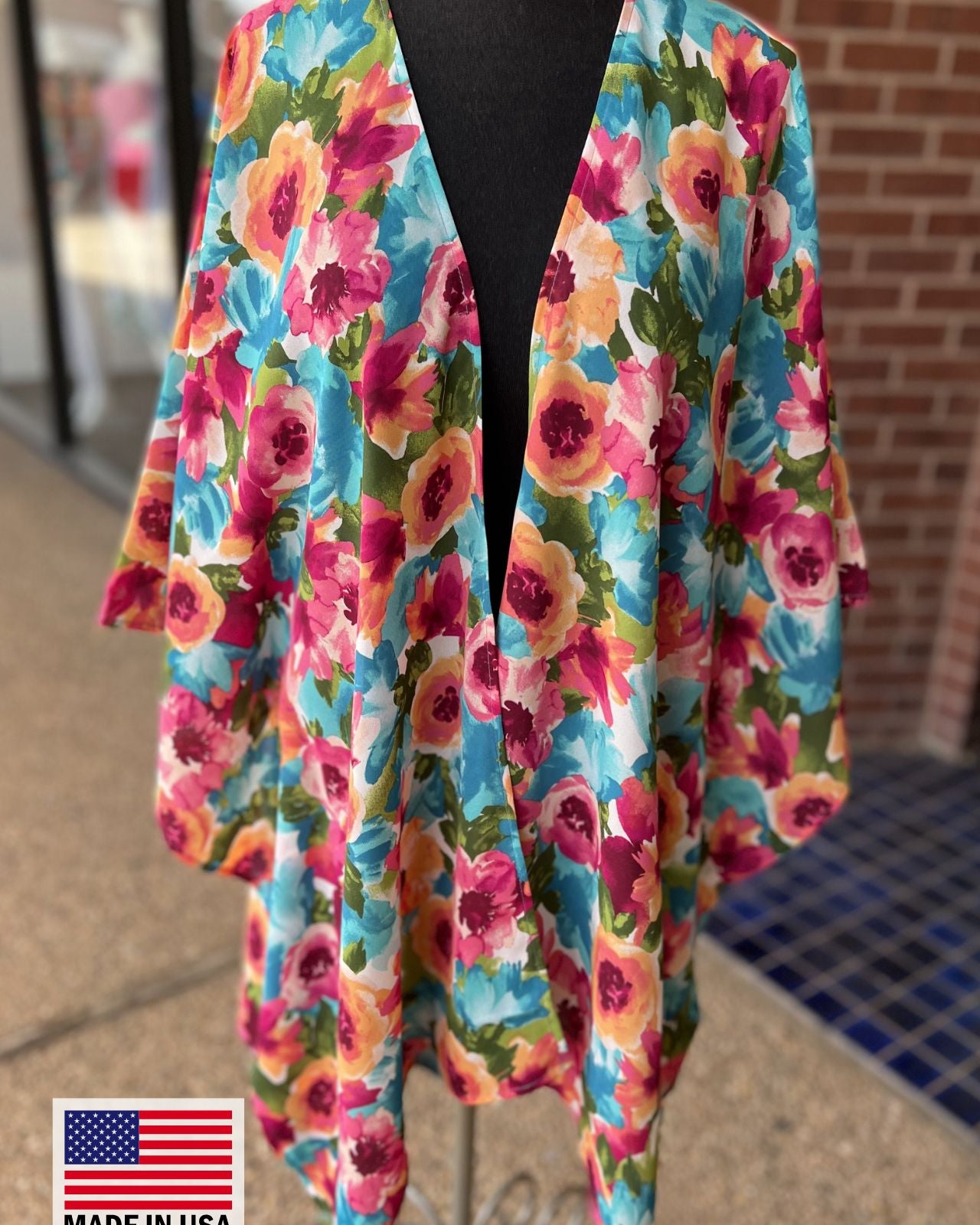made in USA a flowy style open front kimono made of lightweight material with half sleeves on an exclusive vibrant multicolor floral pattern fabric