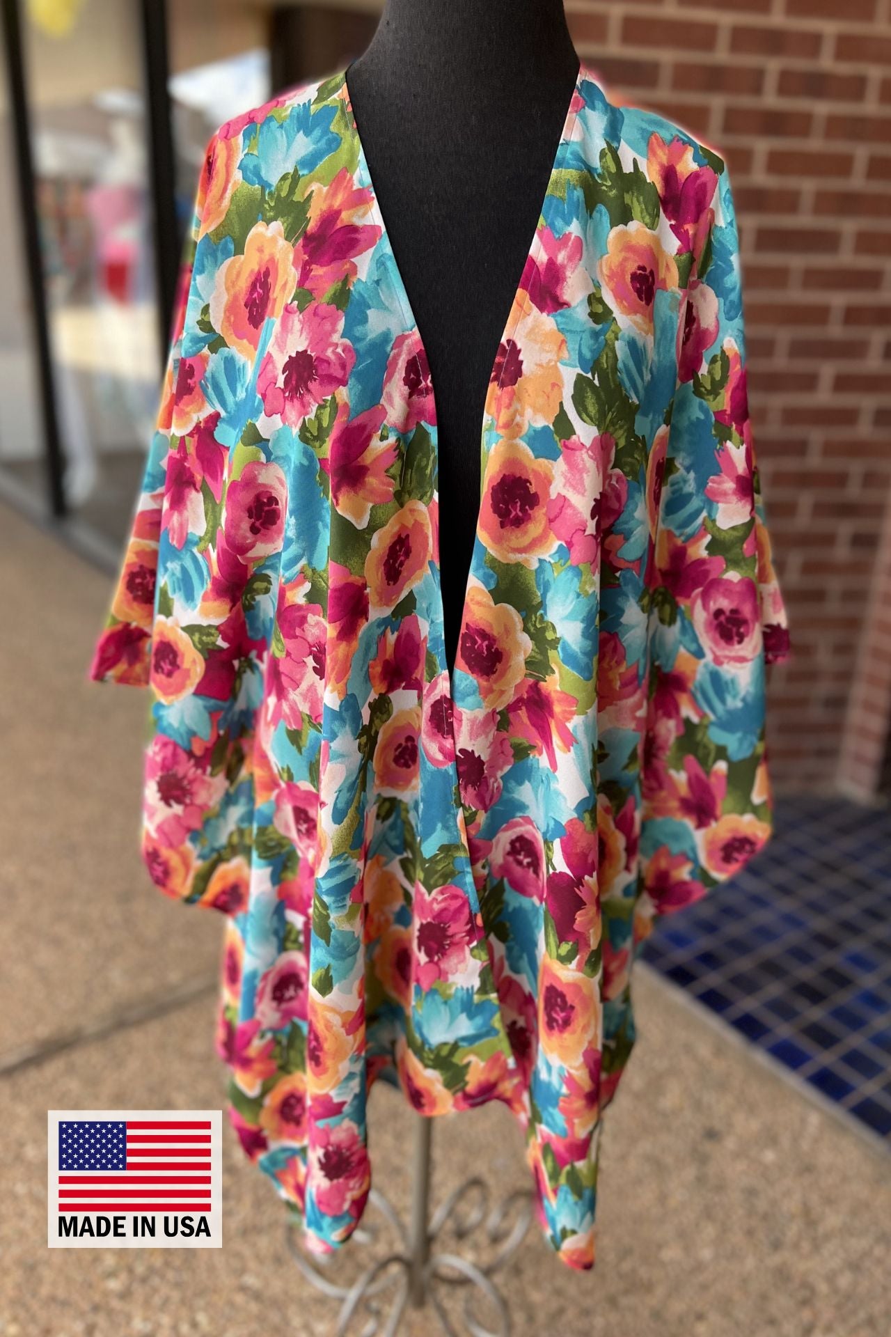 made in USA a flowy style open front kimono made of lightweight material with half sleeves on an exclusive vibrant multicolor floral pattern fabric