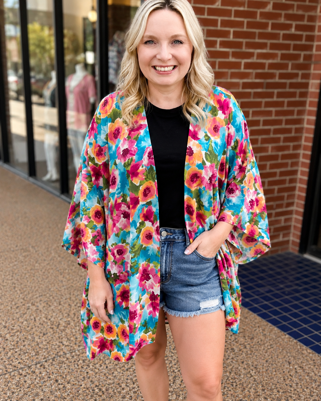 an exclusive, vibrant multicolor floral open-front kimono crafted from limited boutique fabric with lightweight woven material and a fluid, elongated drape