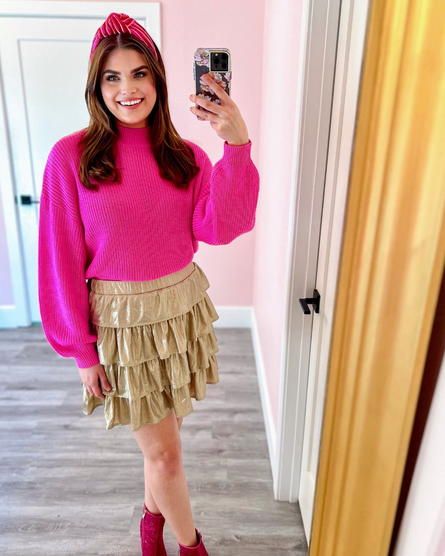 a pink long sleeve sweater with a drop-shoulder for a relaxed fit, a crew neckline, and a ribbed hemline on a textured ultra-soft design fabric