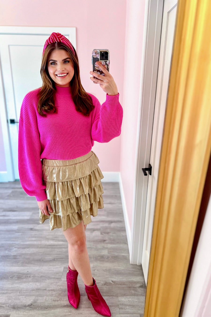 a pink long sleeve sweater with a drop-shoulder for a relaxed fit, a crew neckline, and a ribbed hemline on a textured ultra-soft design fabric