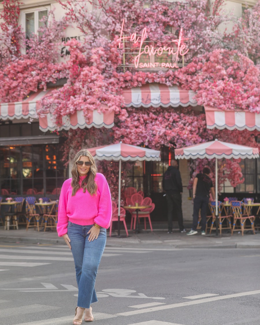 a pink long sleeve sweater with a drop-shoulder for a relaxed fit, a crew neckline, and a ribbed hemline on a textured ultra-soft design fabric