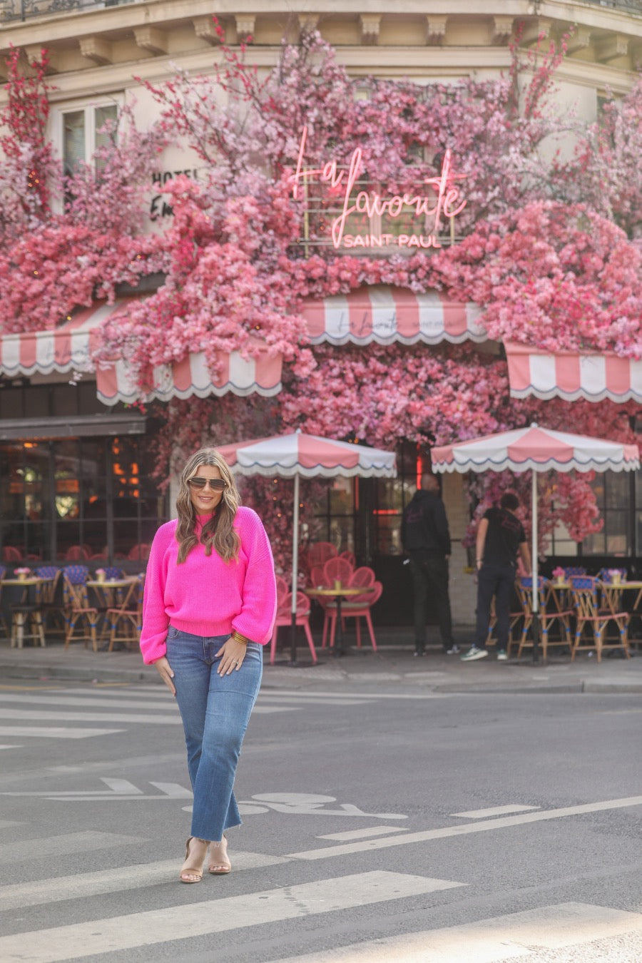 a pink long sleeve sweater with a drop-shoulder for a relaxed fit, a crew neckline, and a ribbed hemline on a textured ultra-soft design fabric