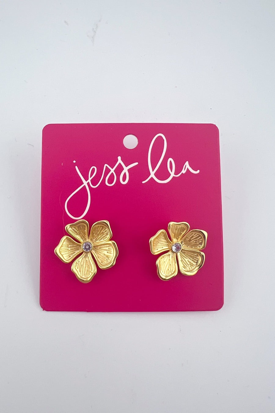 gold intricately detailed flower stud-post earrings with a center stone and comfort earring back in gold