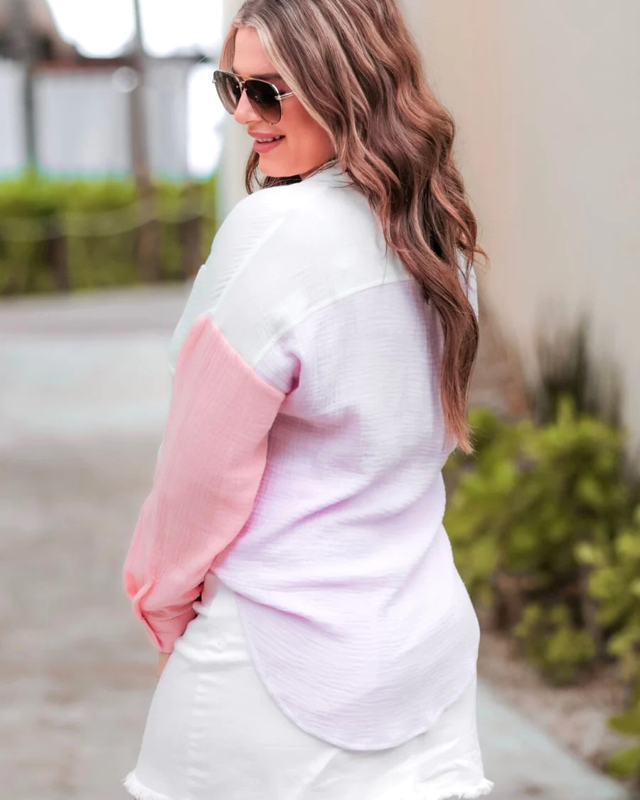 lightweight tri-color block (pink, purple, and white) gauze button-up top with a collared neckline, chest pocket, and relaxed long sleeves