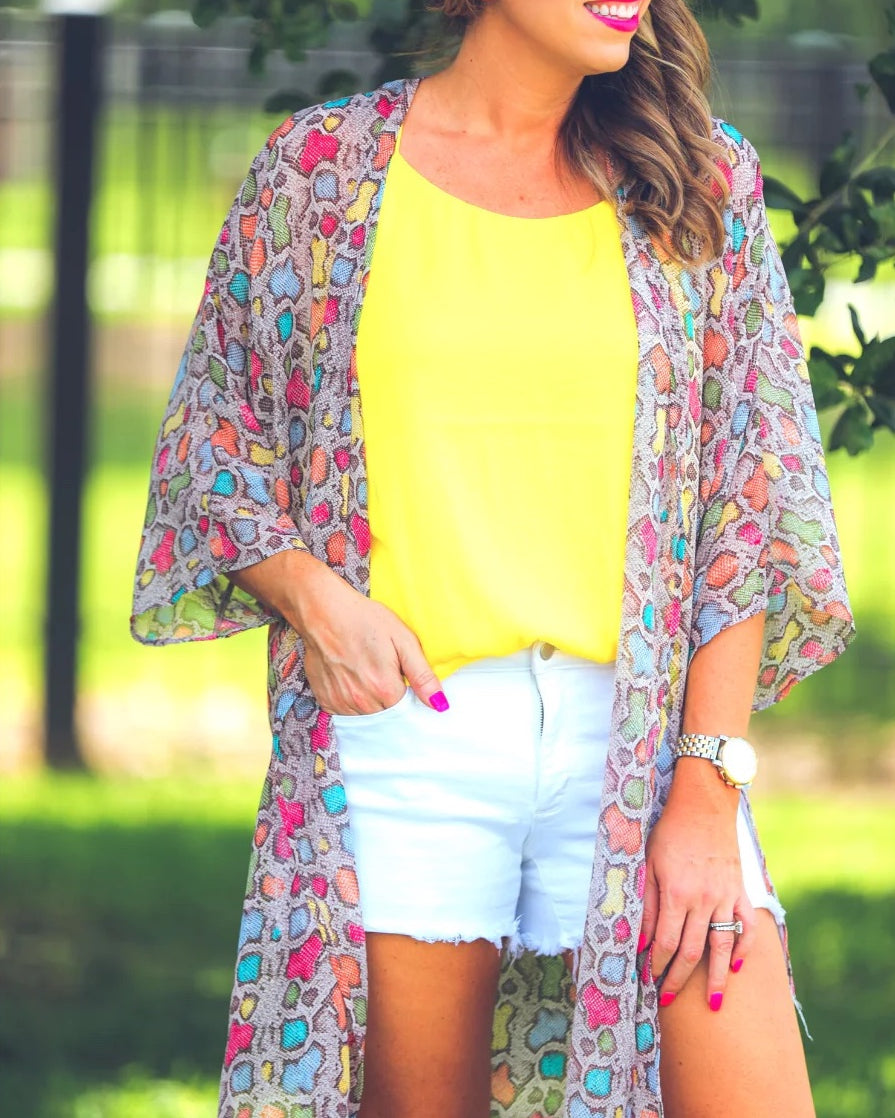 open front kimono made of lightweight material with side slits on a multi-colored snakeskin print fabric