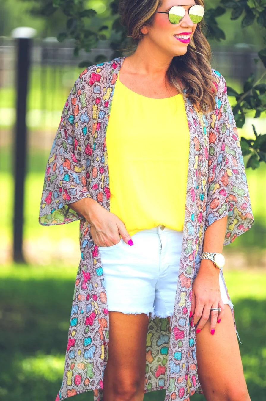 open front kimono made of lightweight material with side slits on a multi-colored snakeskin print fabric