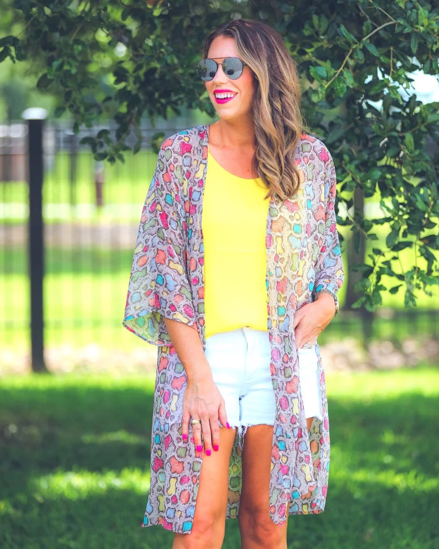 open front kimono made of lightweight material with side slits on a multi-colored snakeskin print fabric