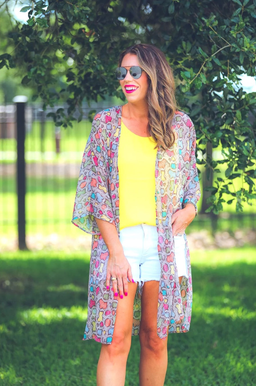 open front kimono made of lightweight material with side slits on a multi-colored snakeskin print fabric